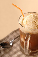 Close up of a root bear float with a spoon