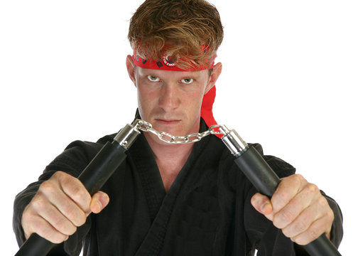 Martial arts man with nun chucks
