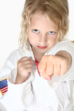 Blond six year old girl doing martial arts
