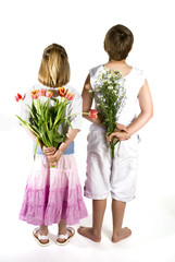 kids are giving you flowers by surprise