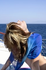 Fototapeta premium Young beautiful girl on a yacht