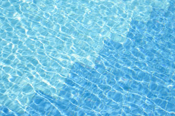 Fototapeta na wymiar blue water of swimming pool at sunny day .