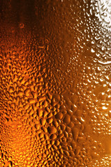 Glass of beer with water drops
