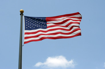 American flag waving in the air.