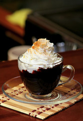 Hot chocolate with whipping cream in cafe