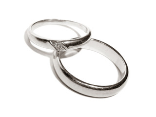 Two wedding gold rings close up platinum toned version
