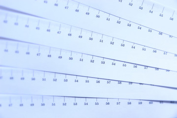 Ruler abstract background. Blue tint and soft focus.