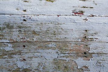 old weathered wood tiles with peeling paint