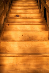 Bare wood stairway (bottom point of view)