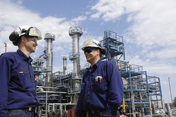 engineers busy infront of oil-refinery
