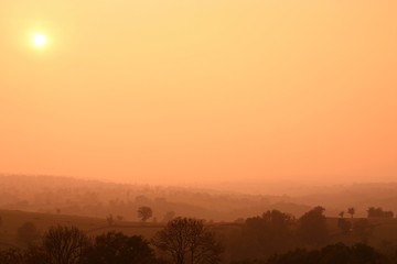 Obraz na płótnie Canvas Sunrise over the hills