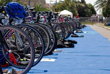 Group of Bikes' wheels in a row  in a triathlon competition.
