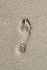 One Foot print on the sand.