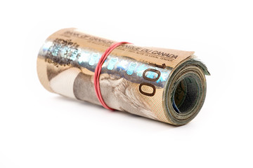 a roll of canadian dollars with white background