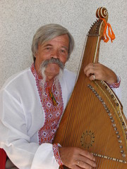 Senior ukrainian musician with bandura 10