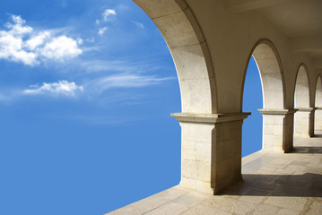 Ethereal image with marble arcades in a blue sky.