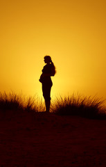expectant mother on sundown
