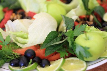 Obraz na płótnie Canvas Close-up of assorted fresh vegetables, fruit and herbs