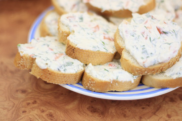 Plate of sandwiches with cheese and vegetable spread