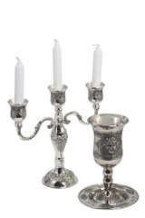 Silver kiddush wine cup and candlestick isolated