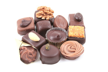 close-ups of mixed chocolates isolated on white