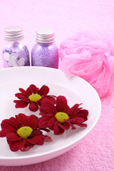 beauty treatment - towel bowl of water and cosmetics