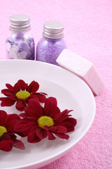 beauty treatment - towel bowl of water and cosmetics