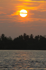 sunset over the mekong river cambodia