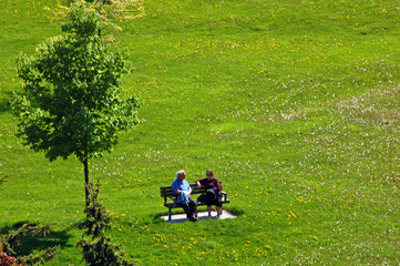 two old people on the bench in park