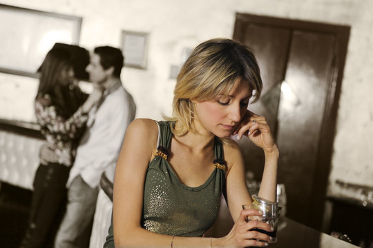 girl alone in a pub
