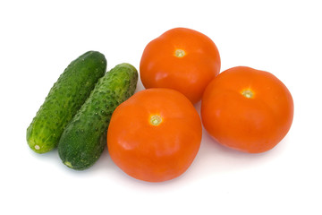 Cucumbers and tomato, isolated on white background