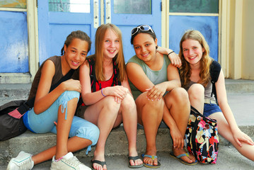 Portrait of a group of young smiling school girls 