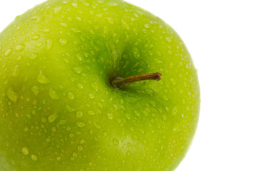 the green apple with water drops on white background