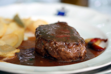 tenderloin steak Beef  on white plate with potatoes 