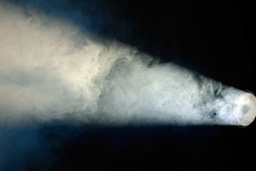 light of disco searchlight in the fog