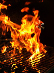 Closeup detail of fire in outdoor BBQ charcoal grill