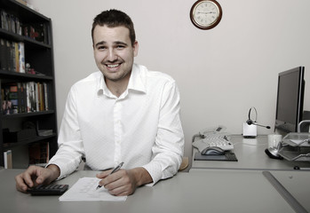 A businessman calculating expenses at tax time