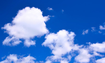 White clouds against a deep blue sky