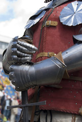 Knight's hands holding a sword. City festival, The Netherlands