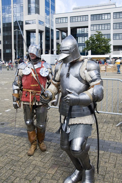 Two knights walking in a modern city