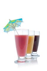 A three milkshakes with flavors reflected on white background