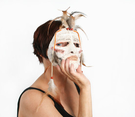 Girl with a papier mache mask