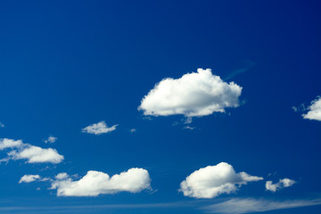 Naklejka na ściany i meble A group of white clouds with blue sky