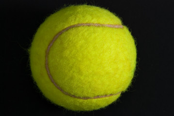 tennis ball on the black background