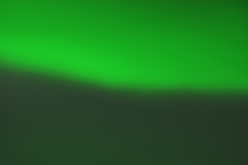 Sloping shape as abstract green background. Blurry image..
