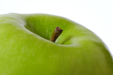 Macro of fresh green aple on white background. Shallow DOF..