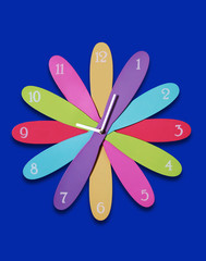 A colorful clock in the shape of a flower over blue
