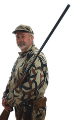 Hunter in camouflage holding a riffle.
