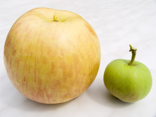 The big mature and small green apples