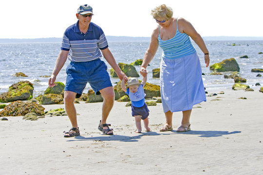 Grandparents at the beach with their grandson